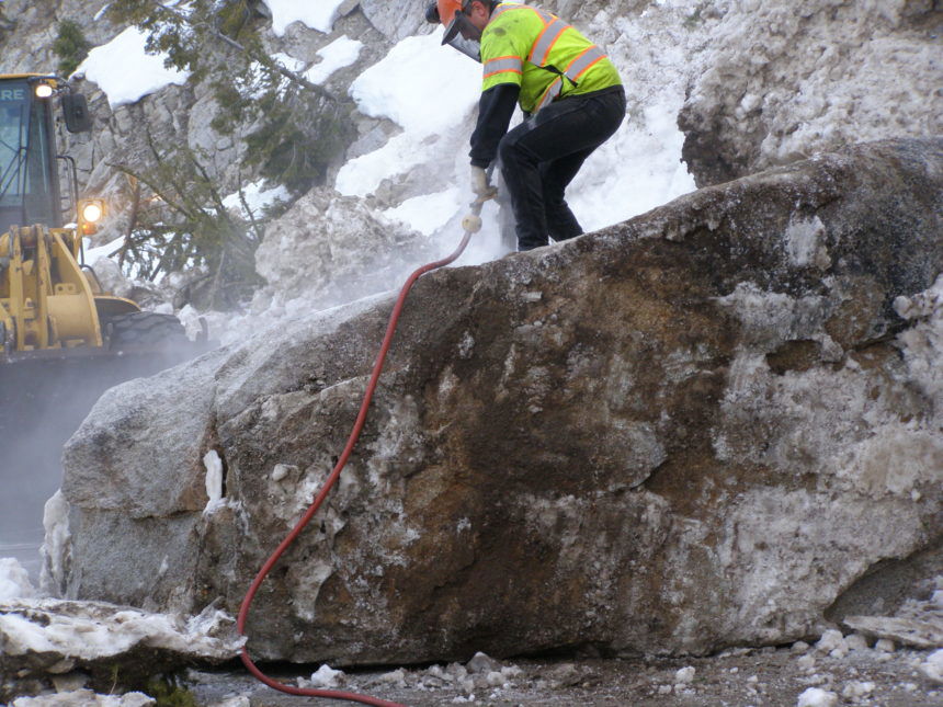 Highway-21-cleanup23_Operator-Dakota-Margan-of-Stanley-drills-holes-into-a-boulder-to-break-it-apart.-scaled.jpg April 9, 2020