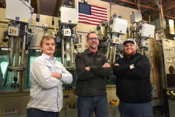 INL RESEARCHERS_Bob Gomez (left), Jon Bradley (center) and Courtney Swassing have worked on assembling and testing the power systems for several NASA missions, including  Perseverance Rover.