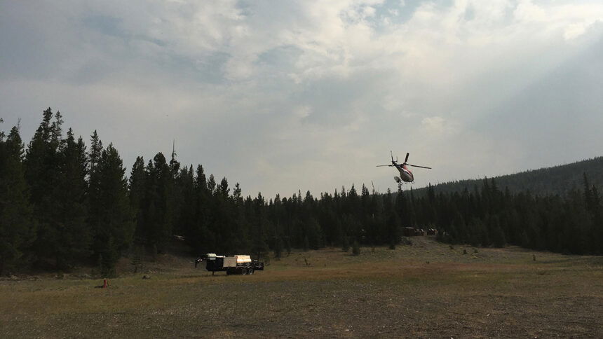 Yellowstone Helitack's helicopter taking off from the helispot near the Incident Command Post on August 24, 2020. Credit- Clayton Hanson, Lone Star Fire Information