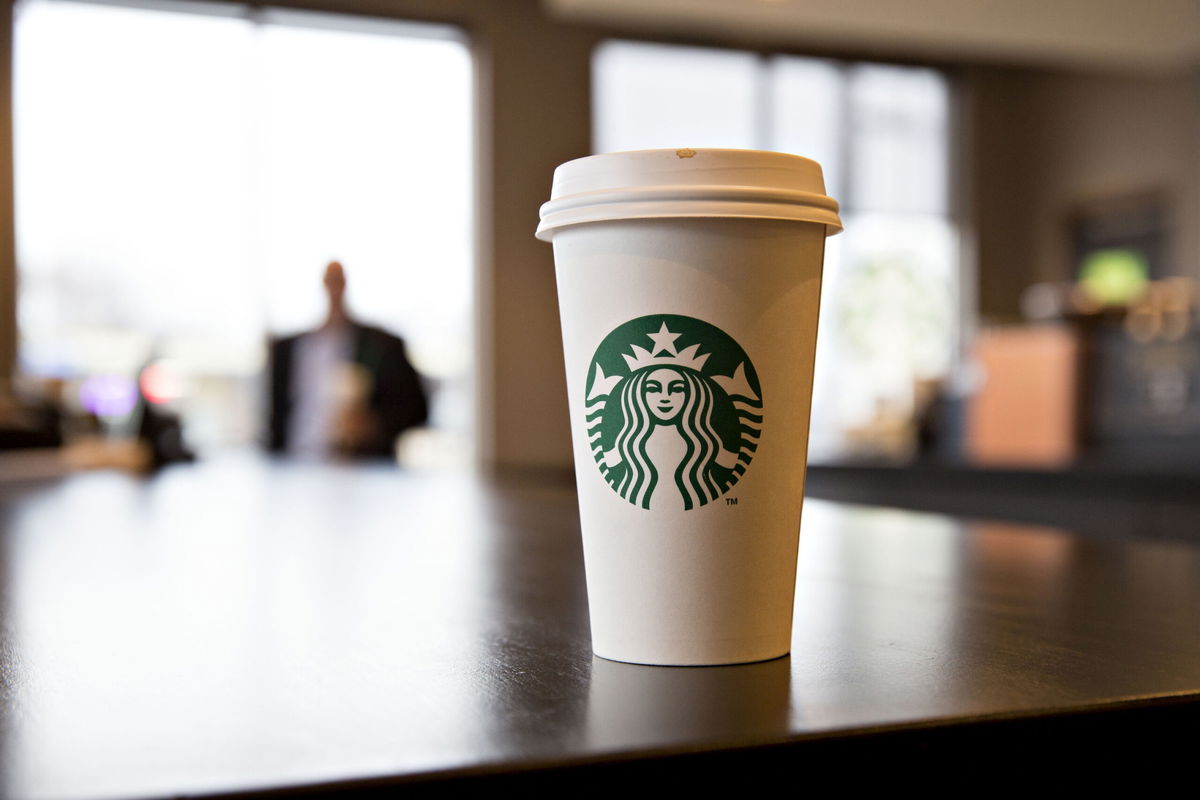 A logo is displayed on a cup inside a Starbucks Corp. coffee shop in Peoria, Illinois, U.S., on Wednesday, Jan. 25, 2017. Starbucks Corp. is expected to release earnings figures on January 26. Photographer: Daniel Acker/Bloomberg via Getty Images
