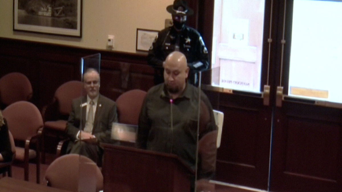 Christopher Tapp speaks in favor of the Wrongful Conviction Act alongside bill sponsor Senator Doug Ricks.