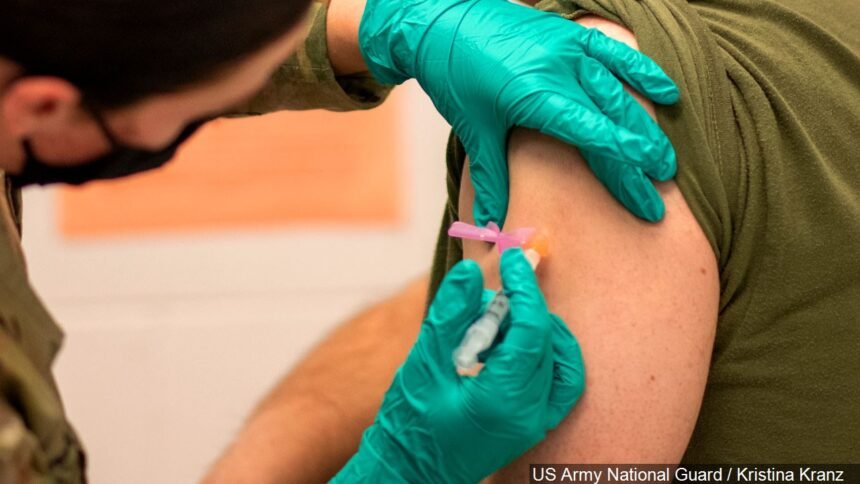 Patient receiving the Moderna COVID-19 vaccine logo - US Army National Guard : Kristina Kranz