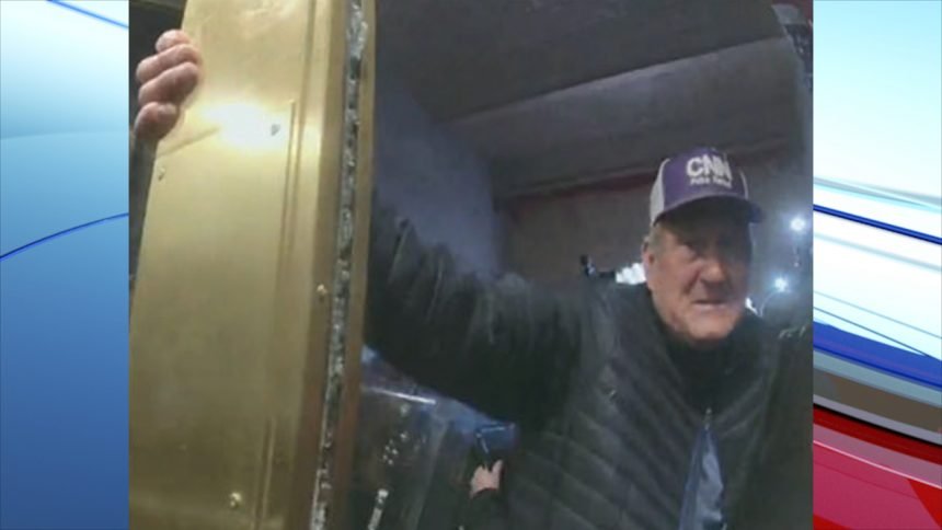 Duke Edward Wilson, 66, of Nampa, Idaho pulling on door