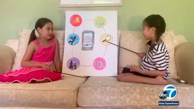 Eight-year old Cambria and Kayla Henry created an app that pairs up with a hearing ai