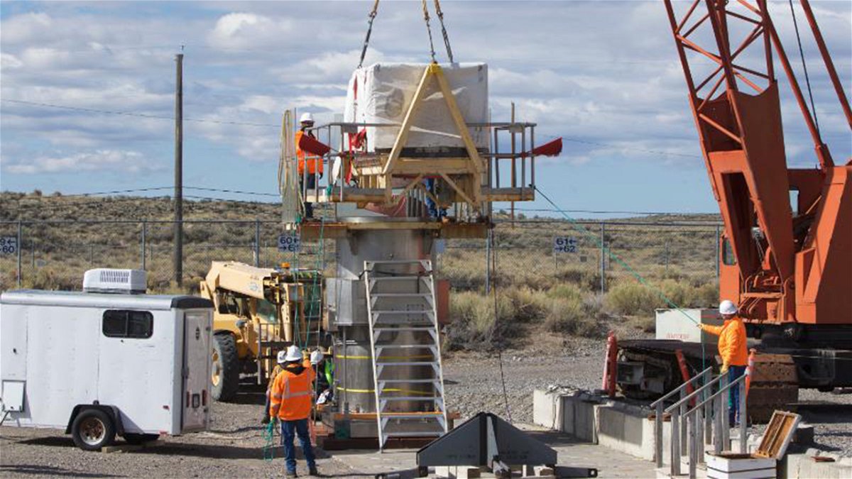 Environmental Management crews prepare to place the final waste shipment into a vault at the Subsurface Disposal Area at the Idaho National Laboratory Site.