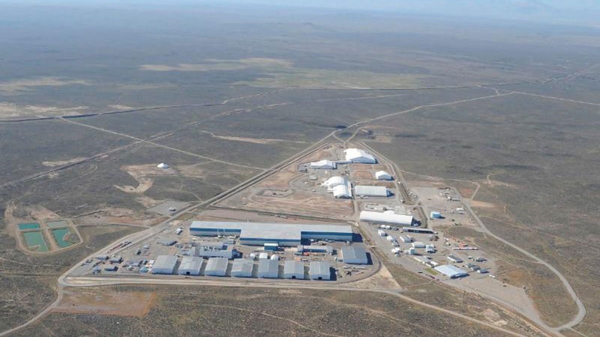 Comparable in size to more than five football fields, the Transuranic Storage Area/Retrieval Enclosure (T-shaped building with blue trim) is the largest building at the DOE Idaho National Laboratory Site.