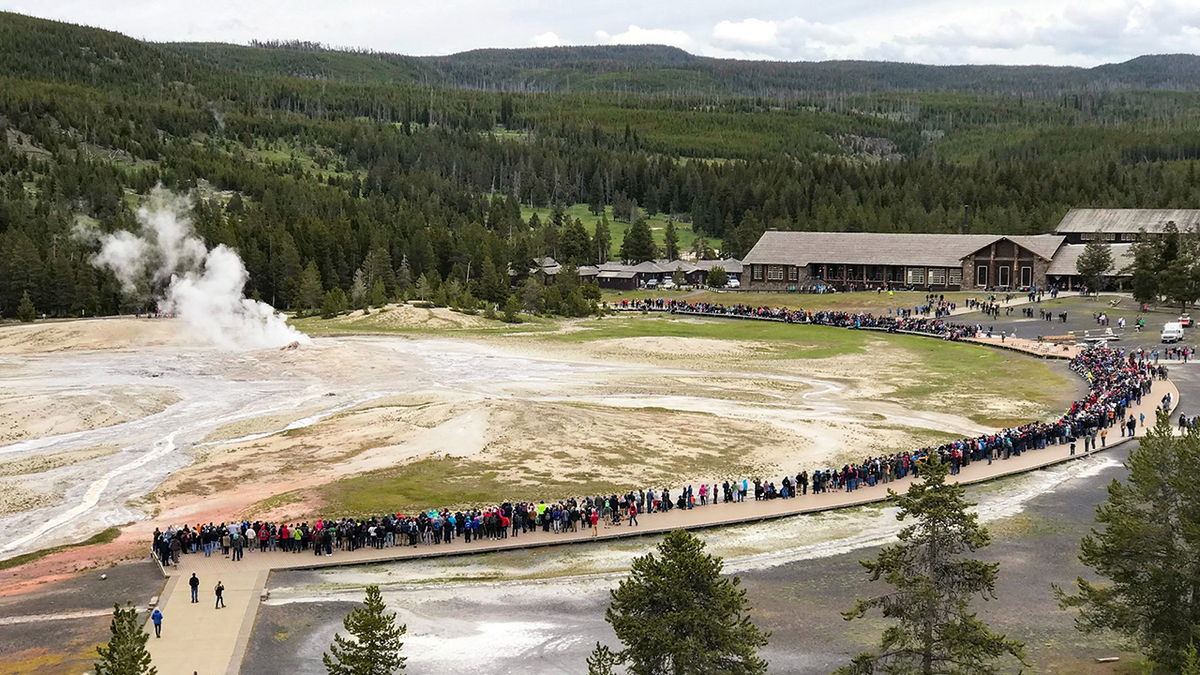 Crowds gather for an Old Faithful Eruption