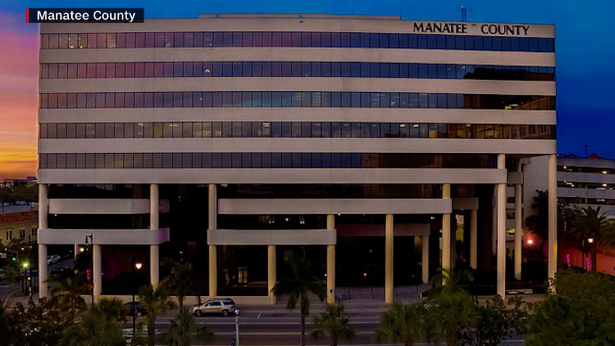 Two people are dead and four of their coworkers were hospitalized after a Covid-19 outbreak swept through a government building in Manatee County, Florida.