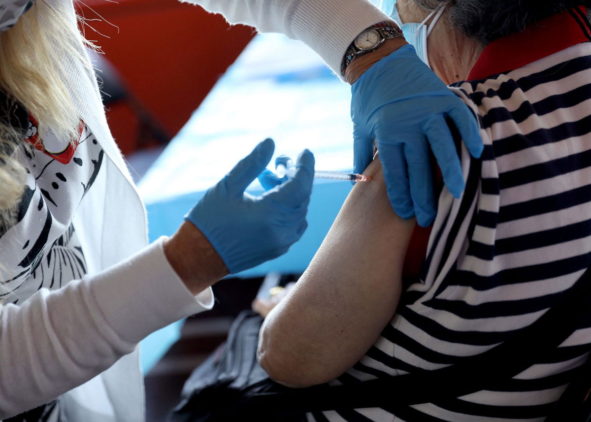 A healthcare worker administers the vaccine as the Empire State Building Offers COVID-19 vaccines at its Observatory in New York City.