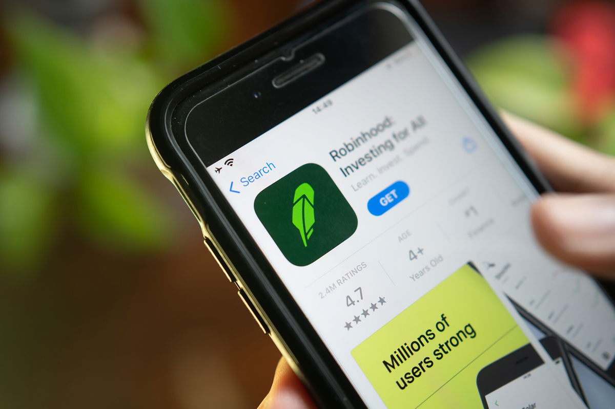 <i>Shutterstock</i><br/>An iPhone user downloading Robinhood App