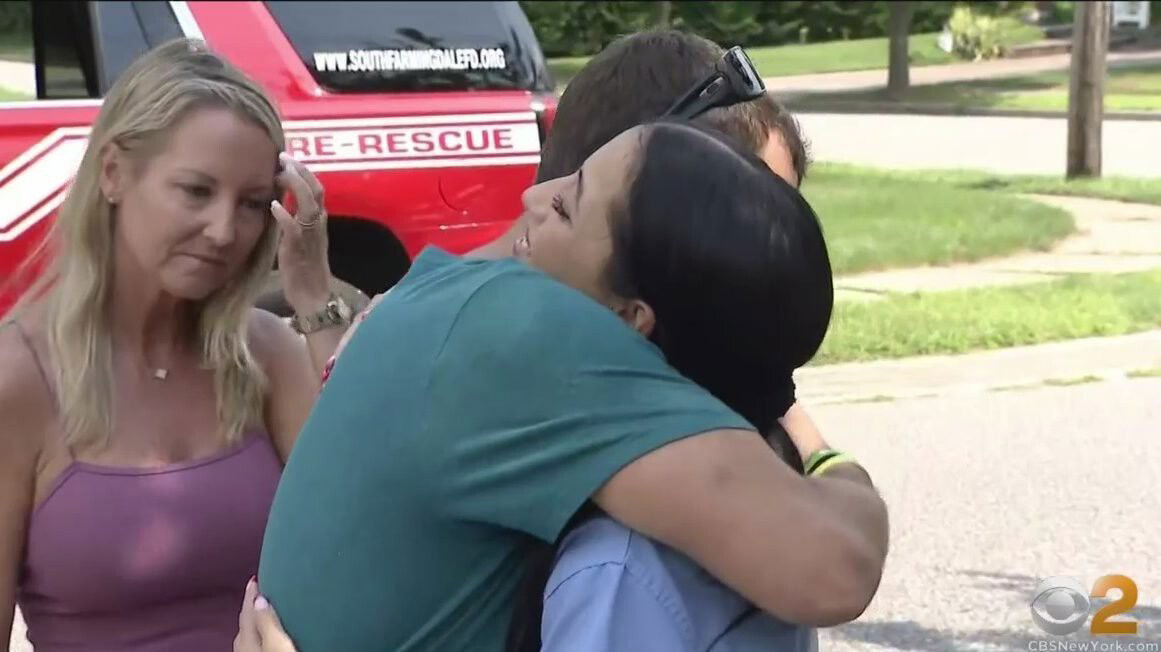 <i>WCBS</i><br/>19-year-old Antonina Barry noticed flames coming from her neighbors' house and got three people and their dog out of their burning home