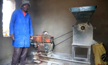 Alfred Makumbe at his grinding mill. His business has been affected by Covid.