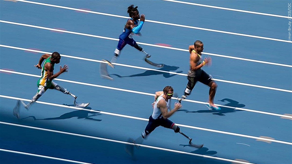 From left to right: Ntando Mahlangu RSA, Regas Woods USA, Richard Whitehead GBR and Leon Schäfer GER compete in the Men's 100m