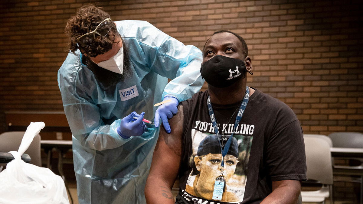 <i>Justin L. Fowler/The State Journal-Register/USA Today Network</i><br/>It will take until mid-February to get at least one dose of Covid-19 vaccine to all eligible Americans