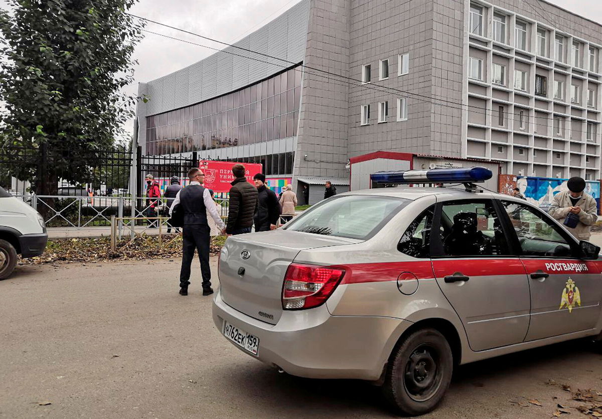 <i>Anna Vikhareva/Reuters</i><br/>A national guard car parked at the Perm State University after a gunman opened fire on Monday.