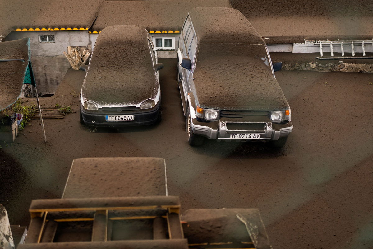 <i>Emilio Morenatti/AP</i><br/>Vehicles are covered by ash from the volcanic eruption on La Palma.
