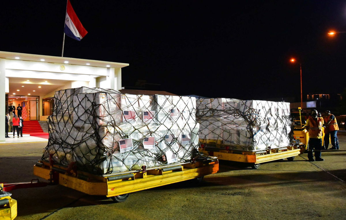 Boxes containing some of the one million doses of the Pfizer vaccine against Covid-19 donated by the United States, are seen upon arrival at the Silvio Pettirossi International Airport, in Luque, Paraguay, on July 9. The United States is set to significantly increase the amount of Covid-19 vaccines it will ship to foreign nations beginning in 2022 in an effort to end the pandemic worldwide, the White House announced Wednesday.
Mandatory Credit: