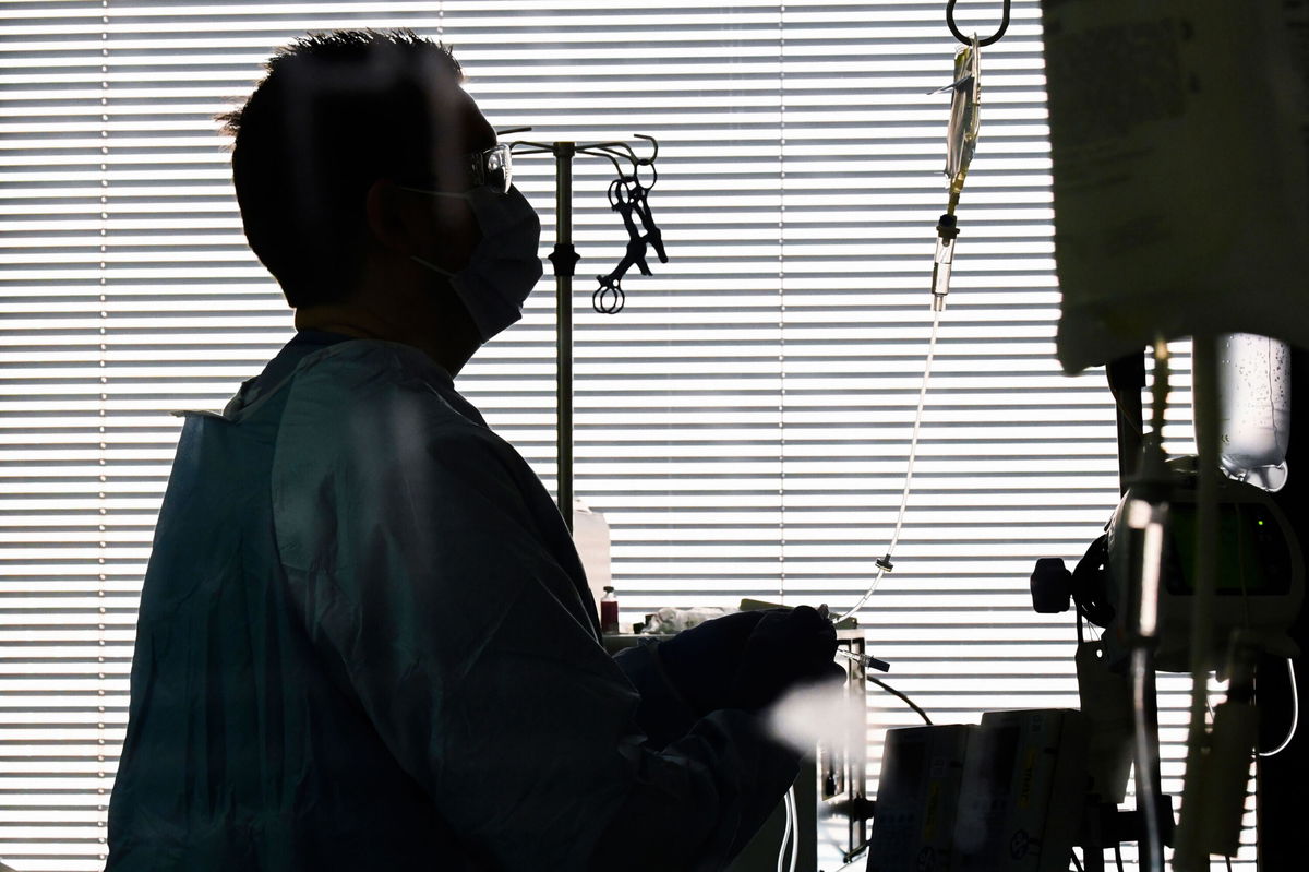 <i>Julie Bennett/AP</i><br/>East Alabama Medical Center nurse Harvard Graham checks fluids for a Covid-19 patient in the intensive care unit Thursday