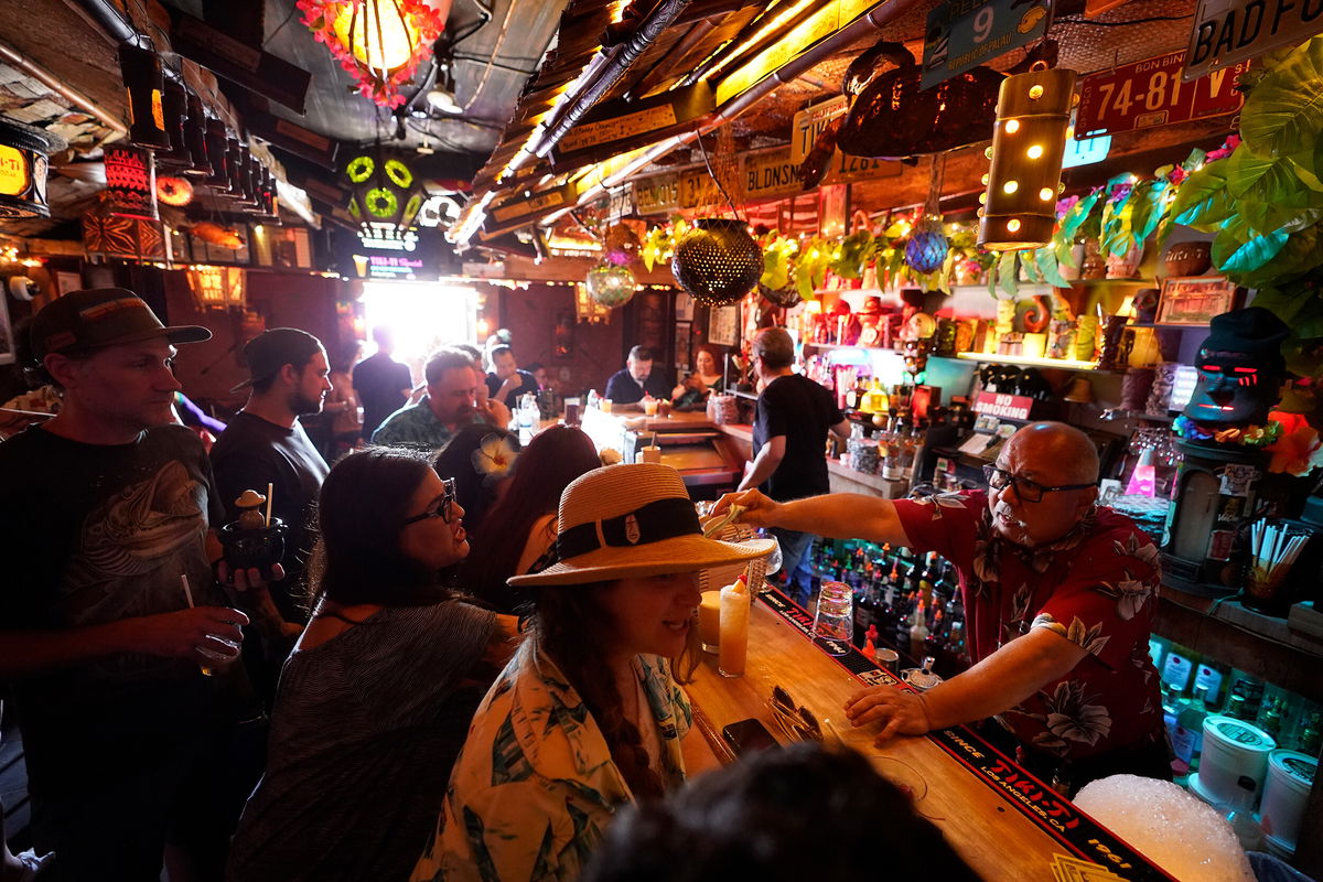 <i>Damian Dovarganes/AP/FILE</i><br/>Los Angeles County will require customers and employees in indoor bars