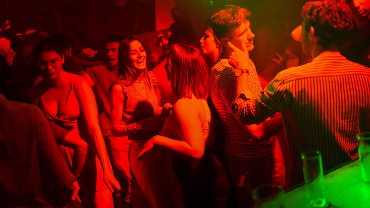 <i>Sebastien Salom-Gomis/AFP via Getty Images</i><br/>French President Emmanuel Macron imposed sweeping vaccination requirements for much of daily life. People here dance in a club in Saint-Jean-de-Monts