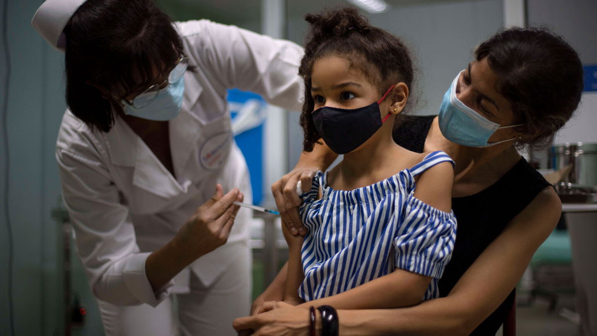 <i>Ramon Espinosa/AP</i><br/>A girl gets a dose of the Cuban-made Soberana-02 vaccine in Havana on August 24.