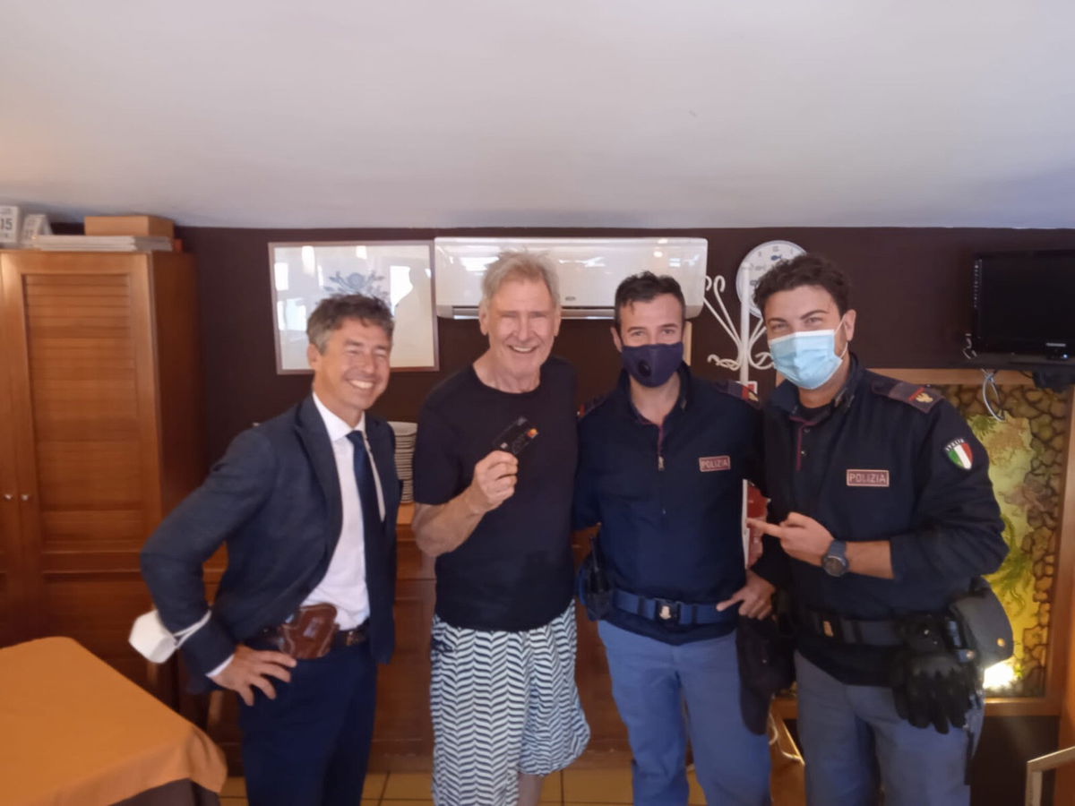 <i>Palermo Police</i><br/>Harrison Ford photographed with police after being reunited with his lost credit card.