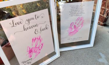 Emily's handprints on a photo Schwartz made to give Carmen once she is older.