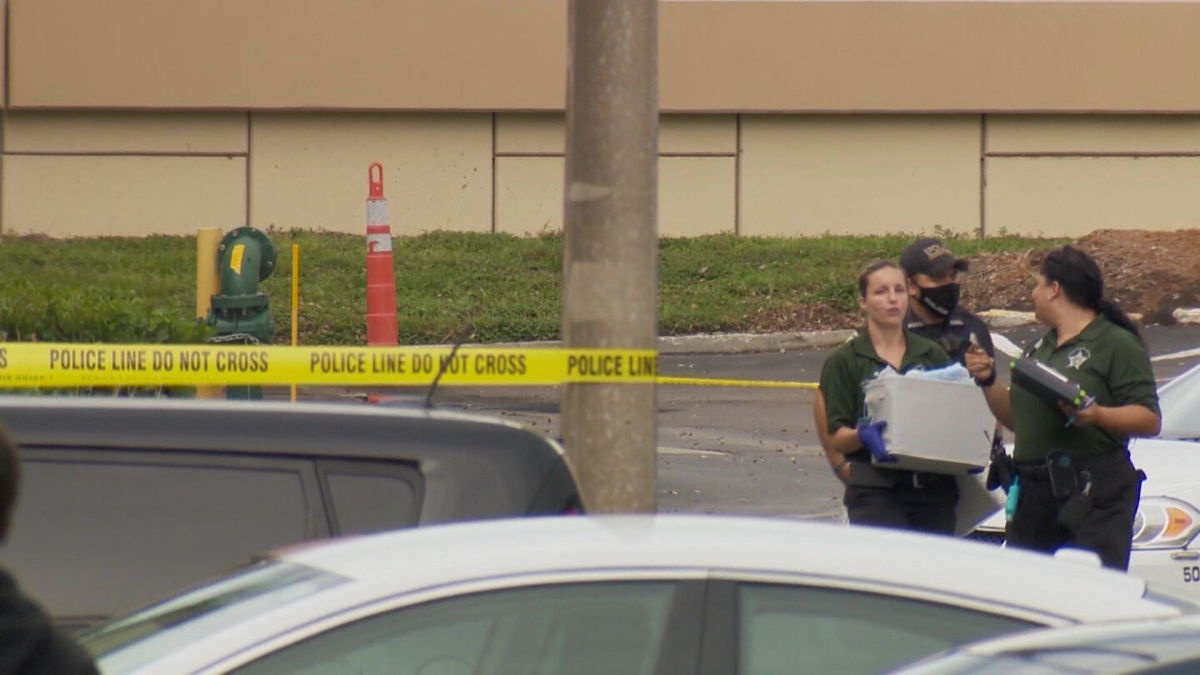 <i>WESH</i><br/>A Florida man has been arrested and charged after a woman was fatally shot by her toddler while she was on a Zoom conference call. Police are shown here on the scene of the shooting in 2020.