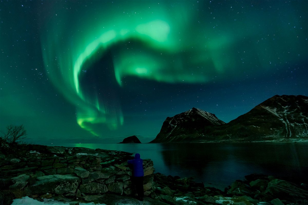 <i>OLIVIER MORIN/AFP/Getty Images</i><br/>A person watches Northern Lights on March 9