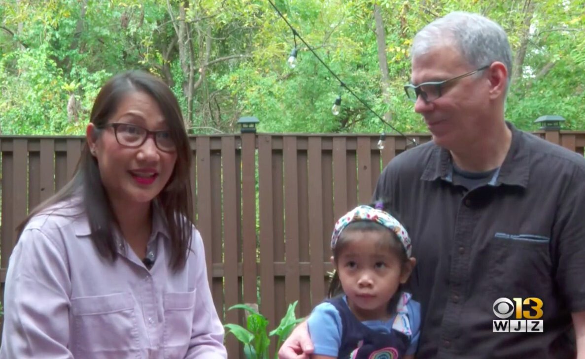<i>WJZ</i><br/>Little Sophia (middle) came into the lives of David and Tex Mordkofsky last summer. The child was adopted from the Philippines.