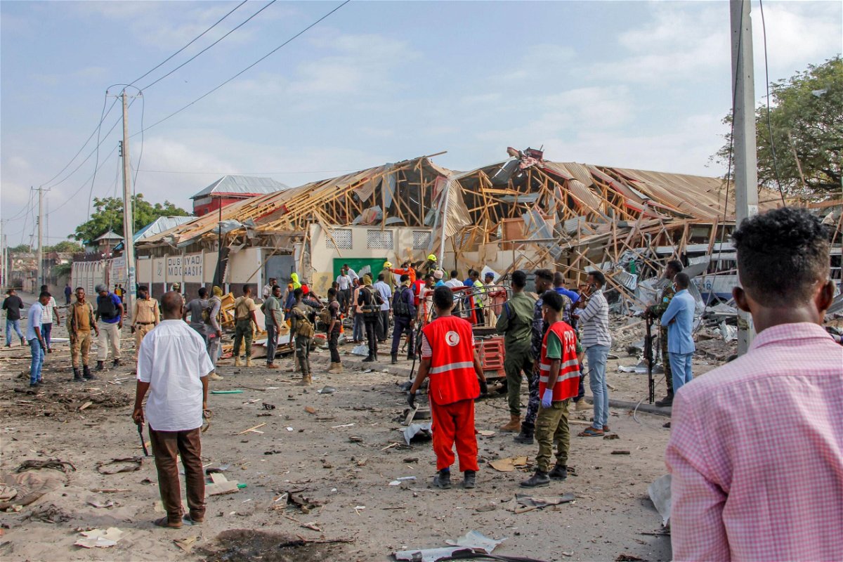 <i>Farah Abdi Warsameh/AP</i><br/>Eight dead and 13 children injured as bomb explodes near school in Somalia. Security forces and rescue workers search for bodies at the blast scene in Mogadishu