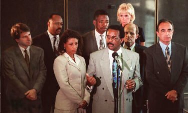 O.J. Simpson defense lawyers hold a press conference following court session in Los Angeles. (L-R) Barry Scheck
