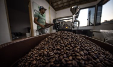 A worker roasts coffee beans at a facility in Caconde