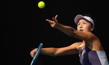 Peng Shuai of China serves to Hibino Nao of Japan during their women's singles first round match at the Australian Open tennis championship in Melbourne