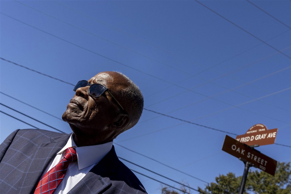 <i>Vasha Hunt/AP</i><br/>Fred Gray poses with the street renamed in his honor at the Fred D. Gray Avenue dedication ceremony in October. The capital of Alabama is coming under fire and facing a large fine after removing a street name honoring president of the Confederacy.