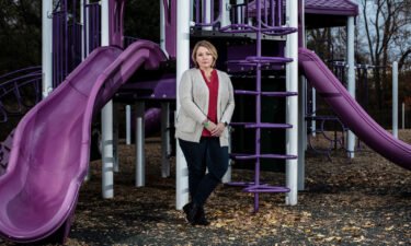 Nicole Hockley poses for a portrait at a playground dedicated to her son Dylan