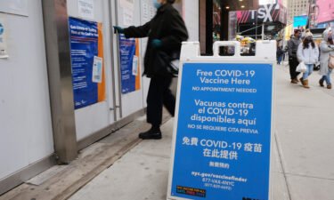 A COVID-19 vaccination pop-up site stands in Times Square on December 9 in New York City.