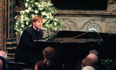 Elton John is pictured singing at the funeral of Princess Diana in September 1997.