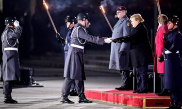 Outgoing German Chancellor Angela Merkel is honored at the Grosser Zapfenstreich