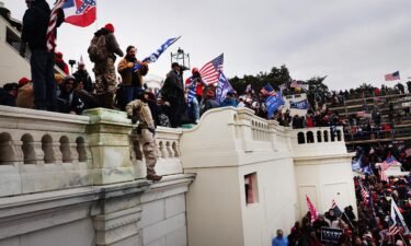 Supporters of then-President Donald Trump storm the US Capitol building following a "Stop the Steal" rally on January 6