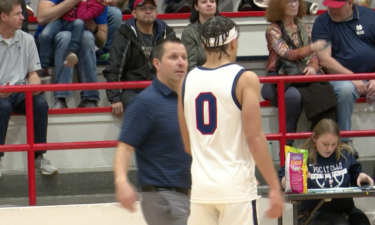 Julian Bowie talks with Head Coach Joe Green in 55-45 win