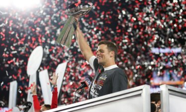 Tampa Bay Buccaneers quarterback Tom Brady (12) holds the Vince Lombardi trophy following the NFL Super Bowl 55 football game against the Kansas City Chiefs