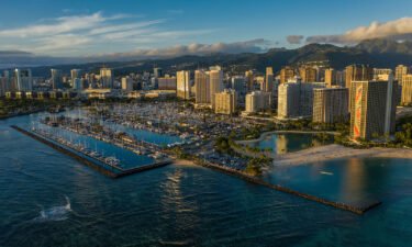 Hawaii will likely soon require visitors to have a Covid booster shot if they want to travel to the islands. Ala Wai Harbor is shown here at dusk in  Oahu