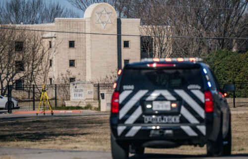 A law enforcement vehicle sits near the Congregation Beth Israel synagogue on January 16