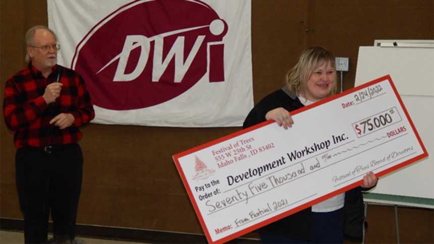 DWI Client Association Secretary Coral receives check from FOT Mike O'Bleness