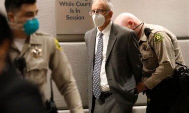 Former UCLA Gynecologist Dr. James Heaps is taken into custody as he appears in Los Angeles Superior Court on August 3
