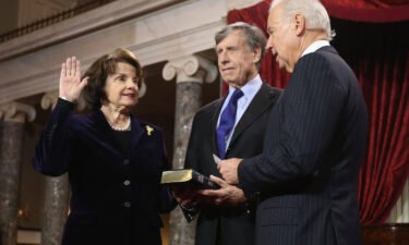 Sen. Dianne Feinstein is seen here with her late husband Richard C. Blum and then-Vice President Joe Biden in the Old Senate Chamber at the US Capitol in January 2013 in Washington