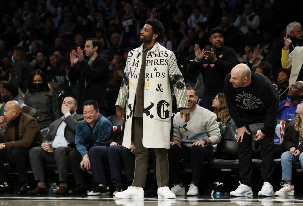 <i>Sarah Stier/Getty Images North America/Getty Images</i><br/>Kyrie Irving watches his teammates courtside against the New York Knicks. The NBA has fined the Brooklyn Nets organization $50