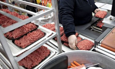 A worker packages trays of ground beef chuck at a supermarket in Princeton