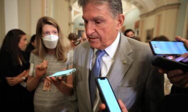 Sen. Joe Manchin talks to reporters as he leaves the the Senate Democrats weekly policy luncheon at the U.S. Capitol on July 20